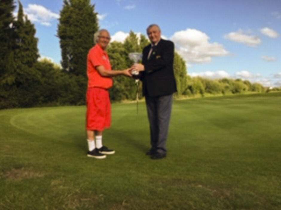 Dave Mellor receiving The Geoff Marks Trophy from Membership Secretary Michael Entecott